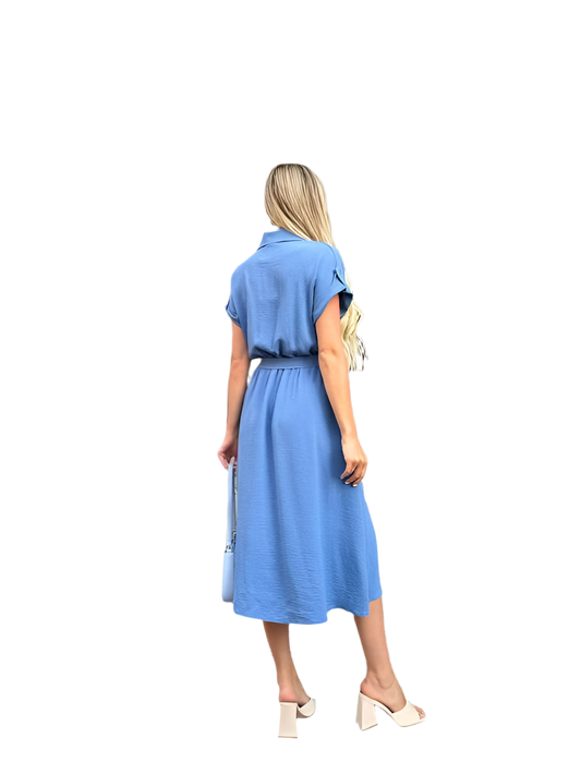 Woman wearing a blue dress with a white background