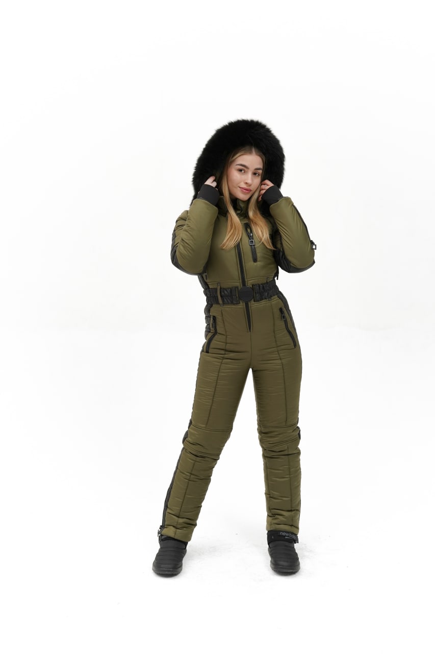 Person wearing a green winter outfit with a fur-lined hood on a white background