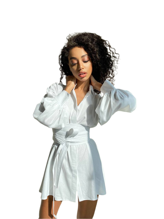 Woman wearing a white shirt with long sleeves on a white background