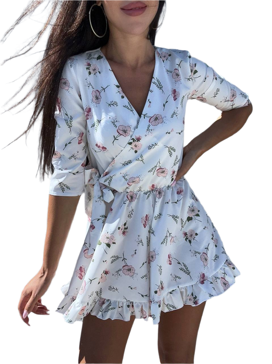 Woman wearing a floral wrap dress on a white background