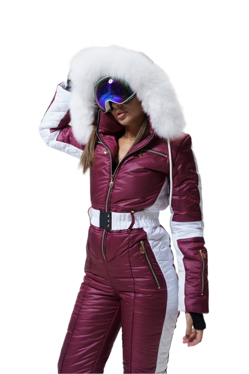 Person wearing a maroon and white ski suit with goggles on a white background