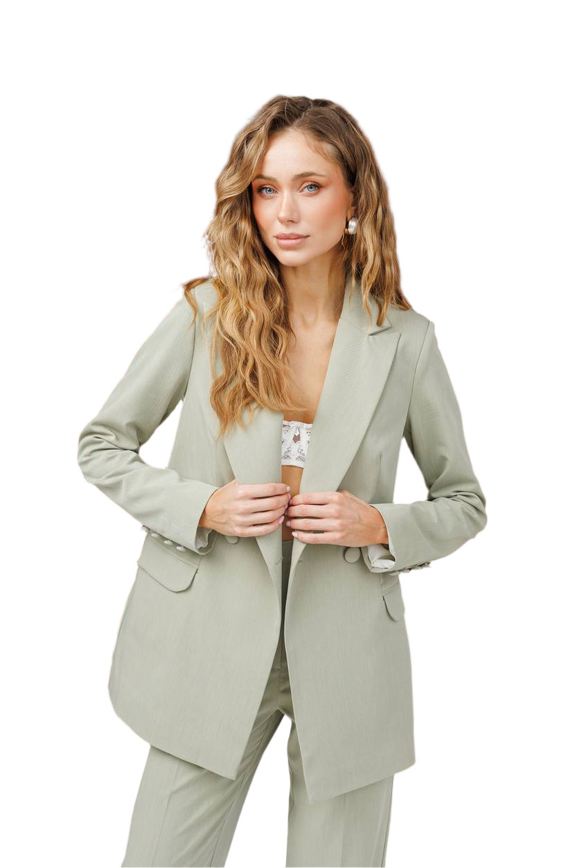 Woman wearing a light green suit on a white background