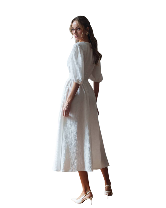 Woman wearing a white dress on a white background