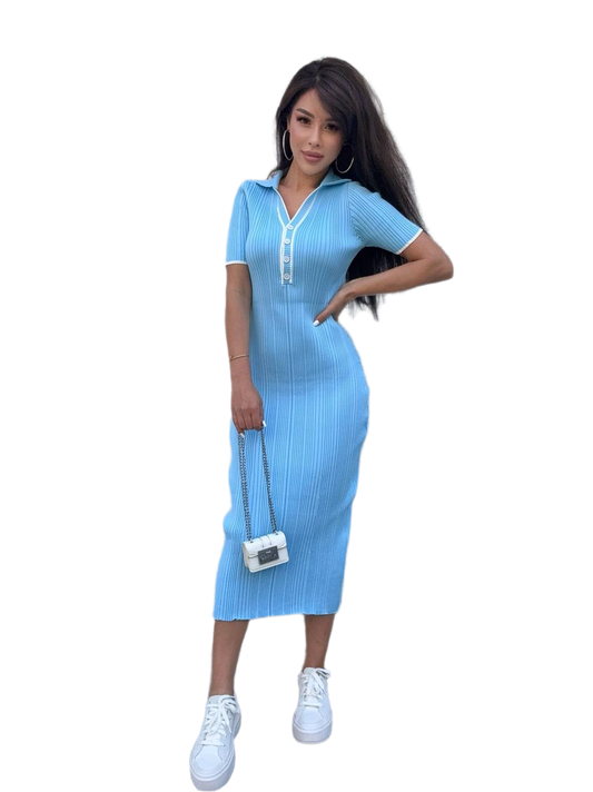 Woman wearing a light blue dress with a white collar on a white background