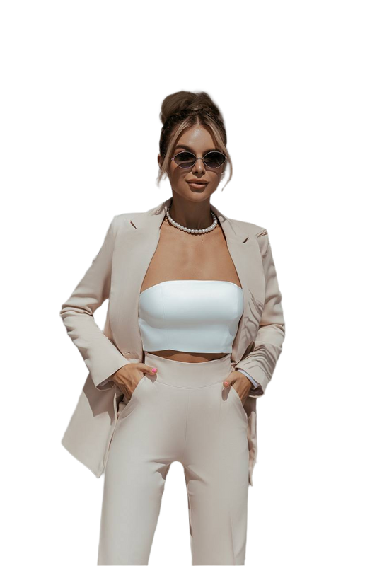 Woman wearing a beige suit with a white top on a white background