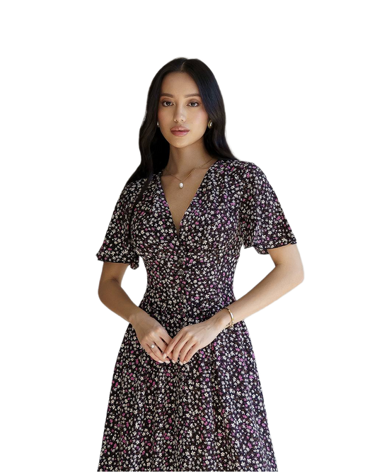 Woman wearing a floral dress on a white background