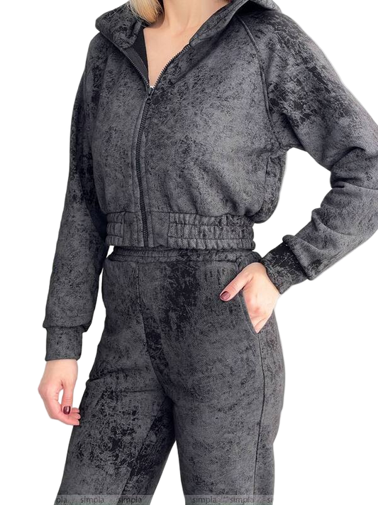 Gray crushed velvet tracksuit worn by a person on a white background