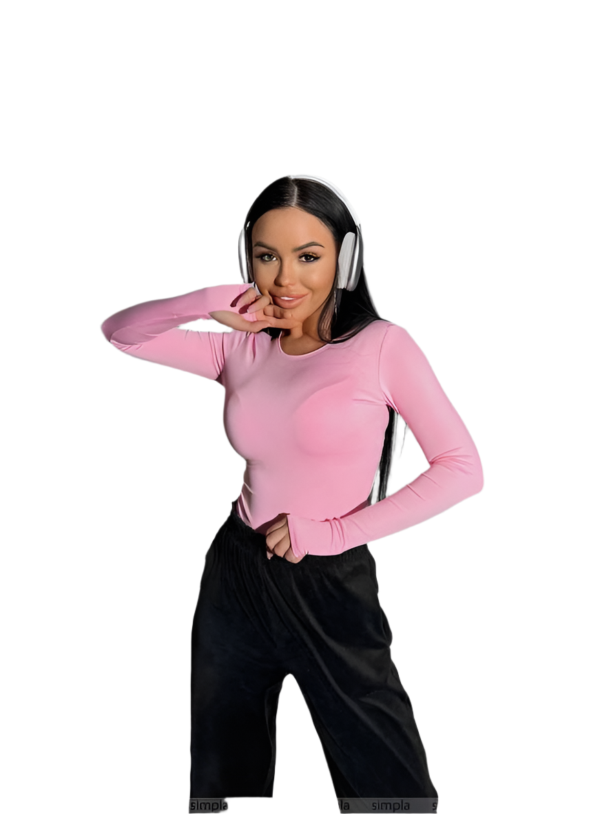 Woman wearing a pink long-sleeve top and black pants on a white background