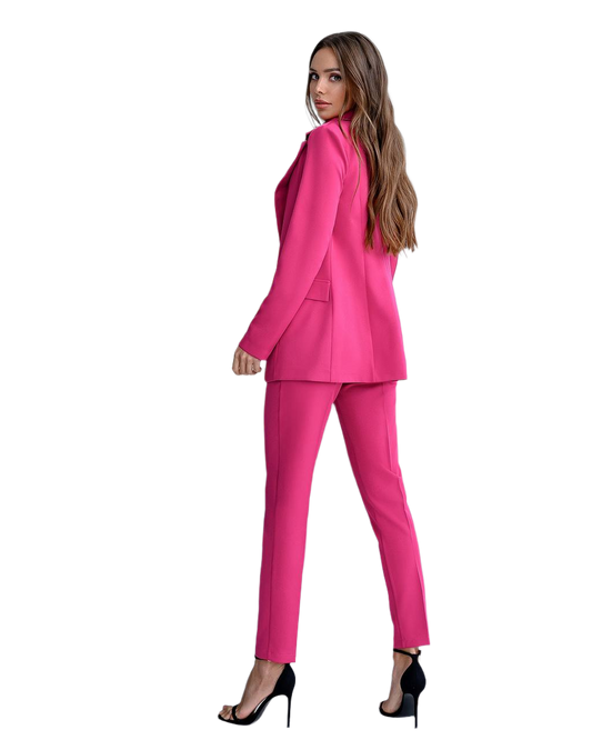 Woman wearing a bright pink suit on a white background