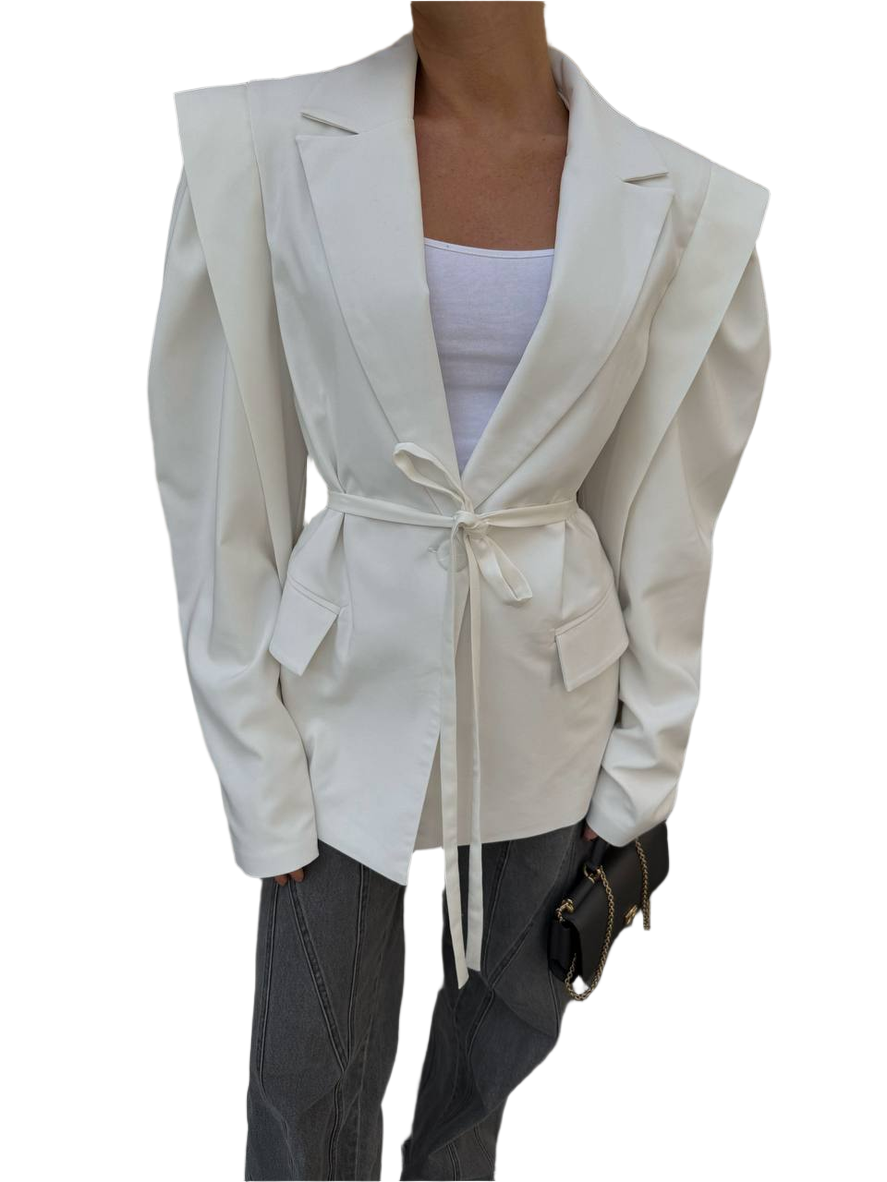 White blazer with a belt tied around the waist on a white background