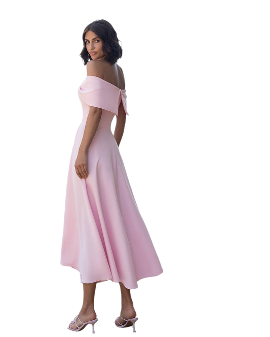 Woman wearing a pink off-shoulder dress on a white background