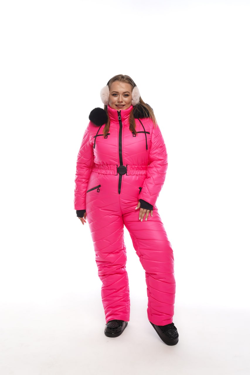 Person wearing a bright pink snowsuit with black accents on a white background