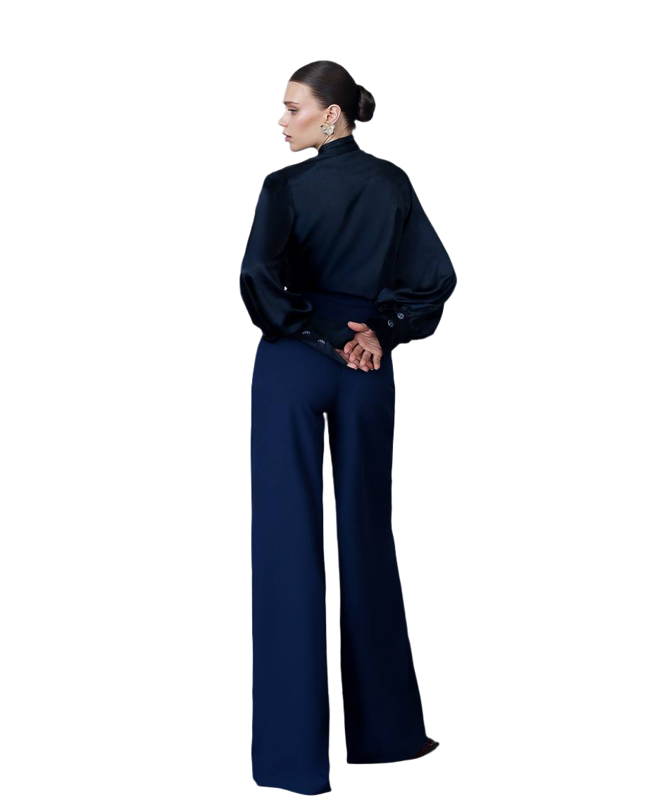 Woman wearing a navy blue outfit on a white background