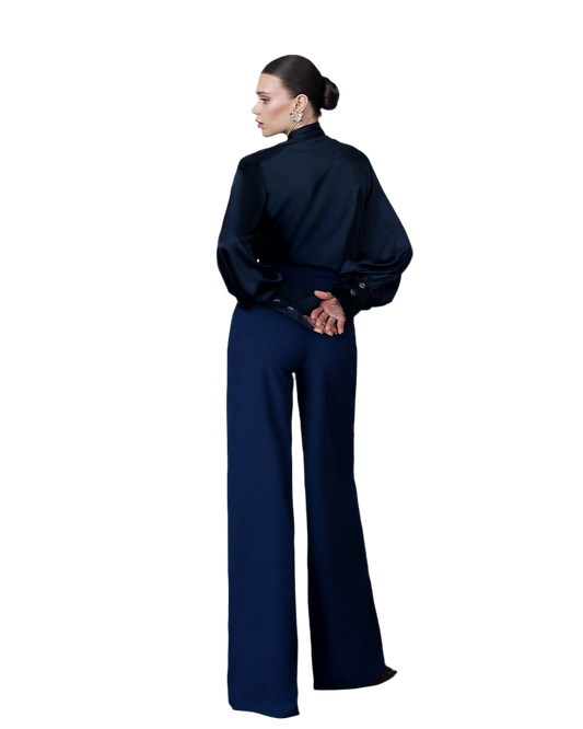 Woman wearing a navy blue outfit on a white background