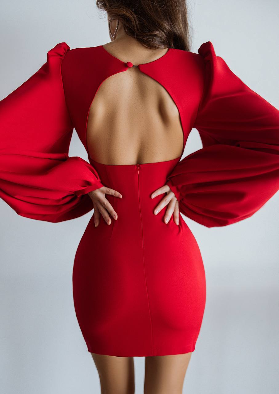Red dress with puffed sleeves on a plain background