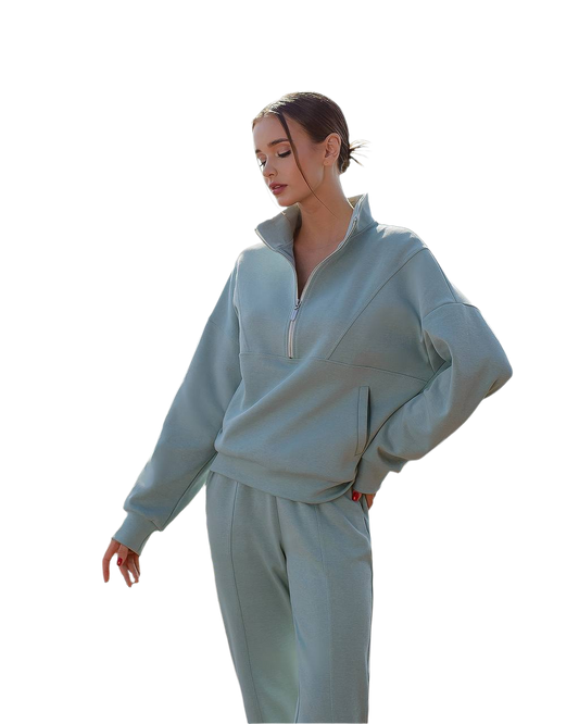 Woman wearing a light blue tracksuit on a white background