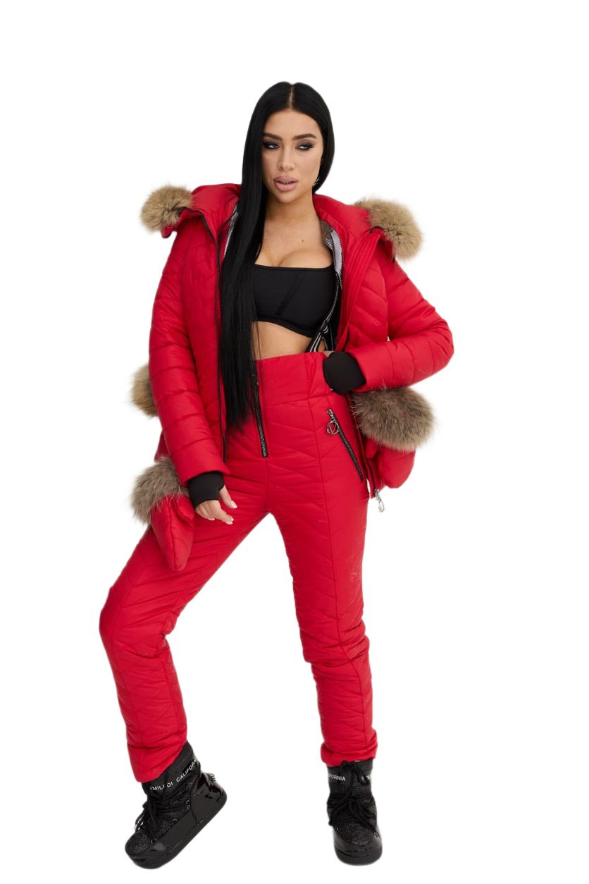 Person wearing a red puffer jacket and pants with fur trim on a white background