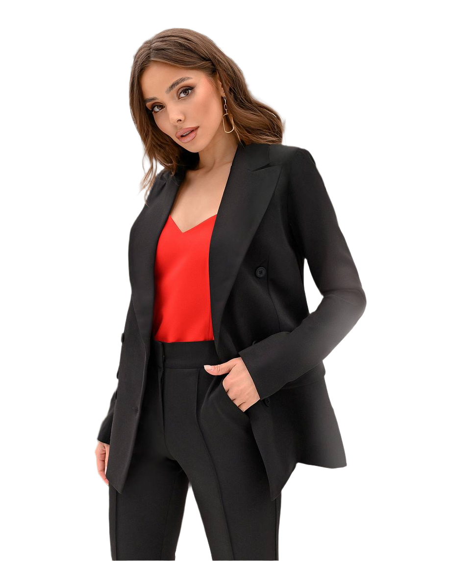 Woman wearing a black blazer and red top on a white background