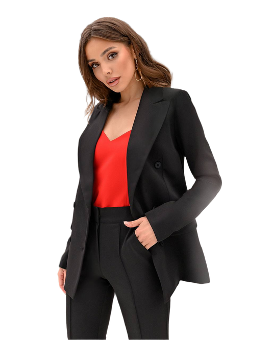Woman wearing a black blazer and red top on a white background