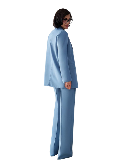 Woman wearing a light blue suit on a white background