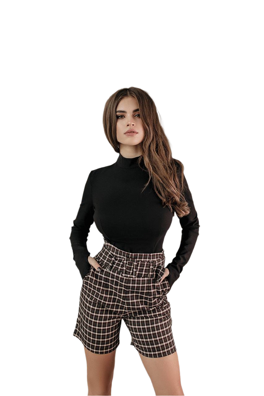 Woman wearing a black turtleneck and plaid shorts on a white background