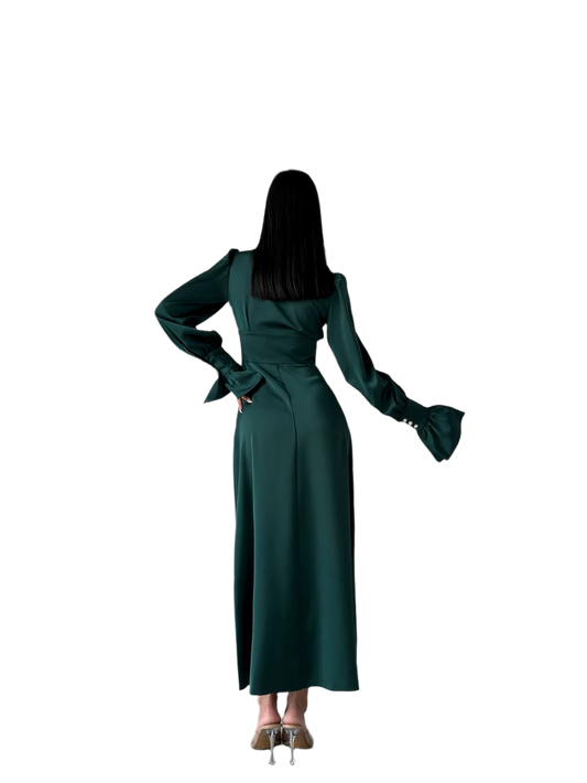 Green dress worn by a person on a white background