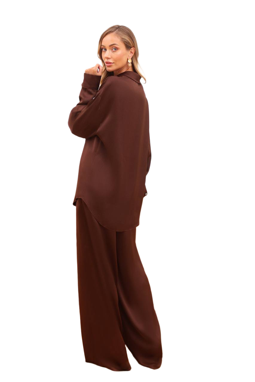 Woman wearing a brown outfit on a white background