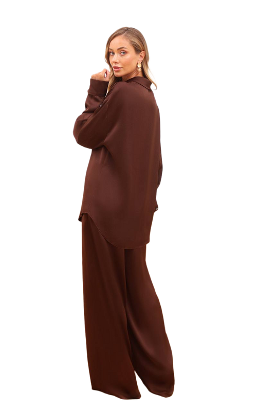 Woman wearing a brown outfit on a white background