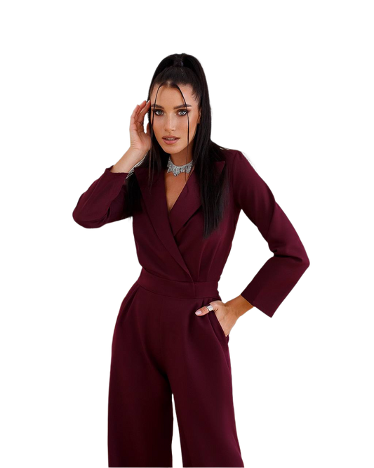 Woman wearing a burgundy jumpsuit on a white background