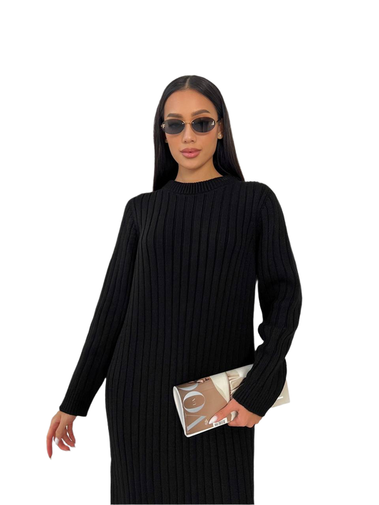 Woman wearing a black ribbed sweater and sunglasses on a white background
