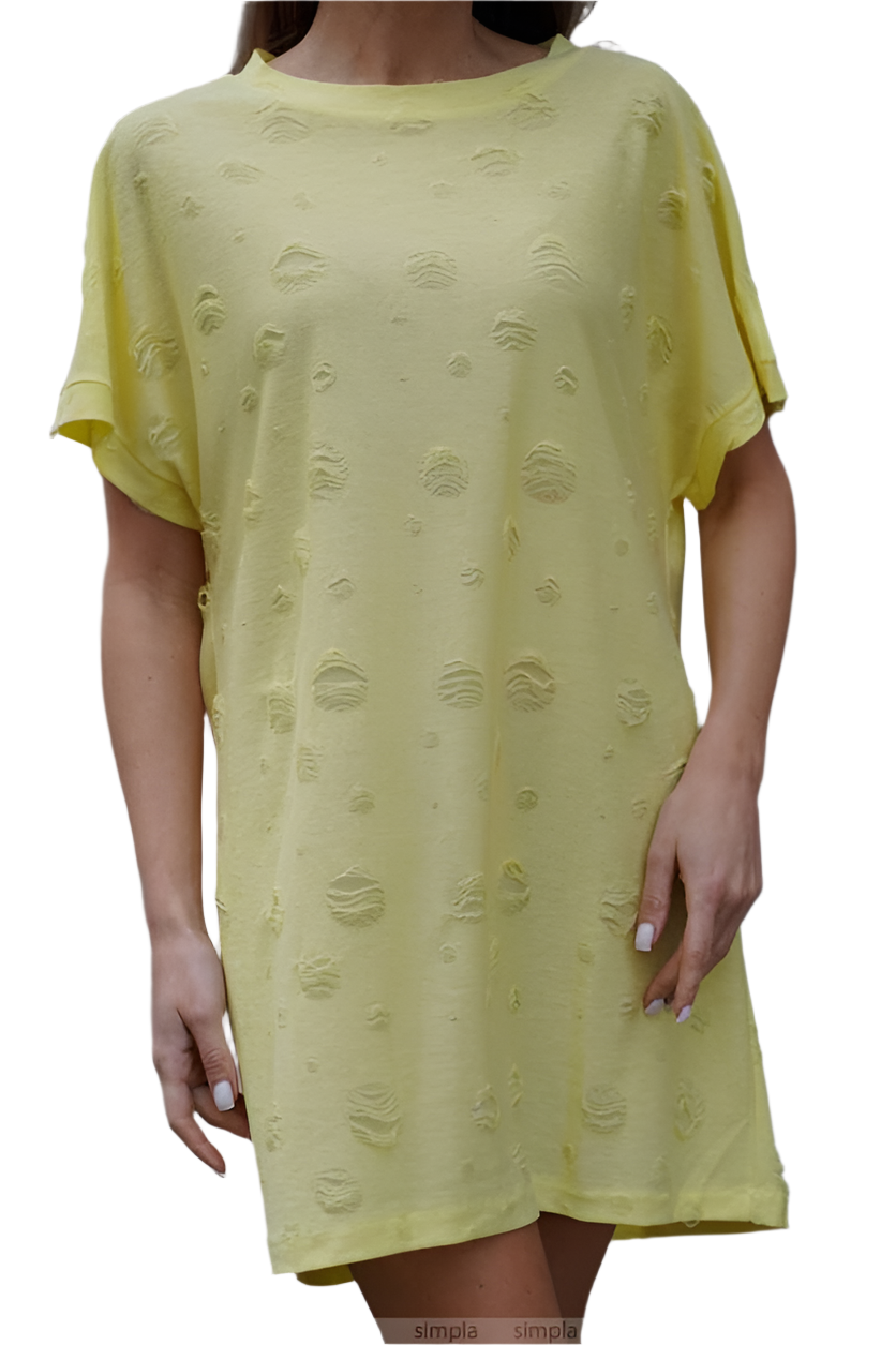 Yellow dress with textured pattern worn by a person on a white background