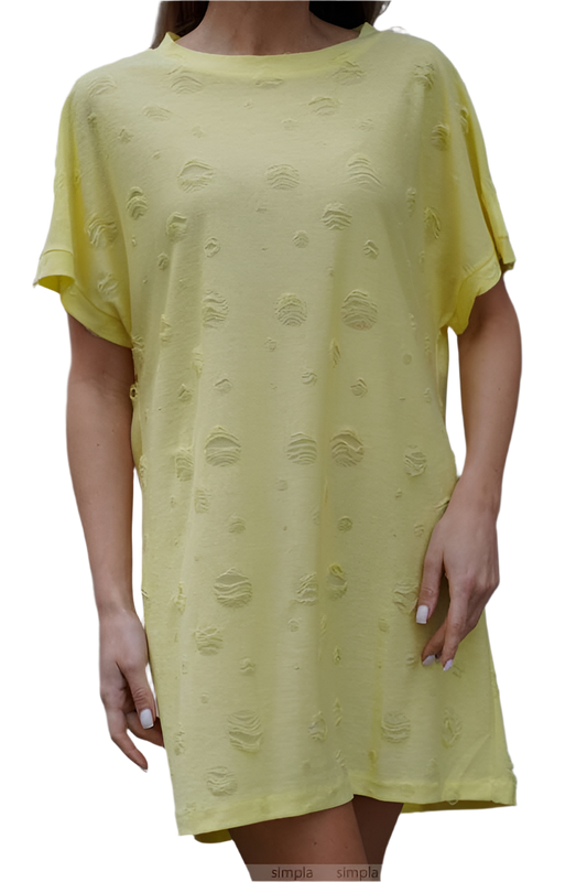 Yellow dress with textured pattern worn by a person on a white background