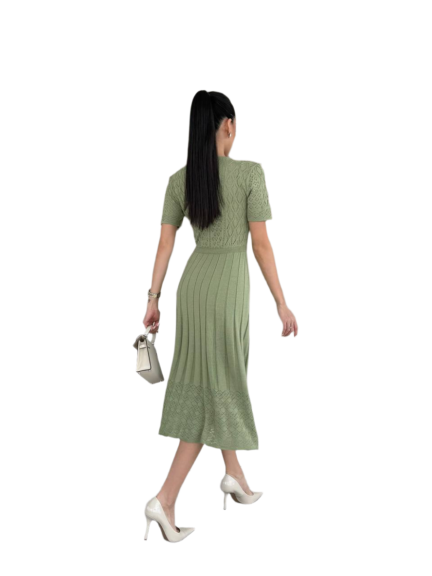 Woman wearing a green dress on a white background