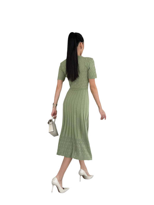 Woman wearing a green dress on a white background