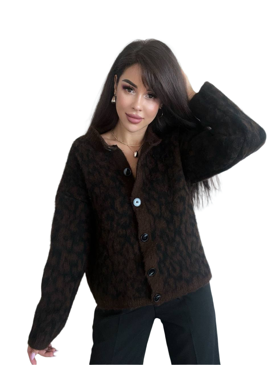 Woman wearing a brown patterned jacket on a white background
