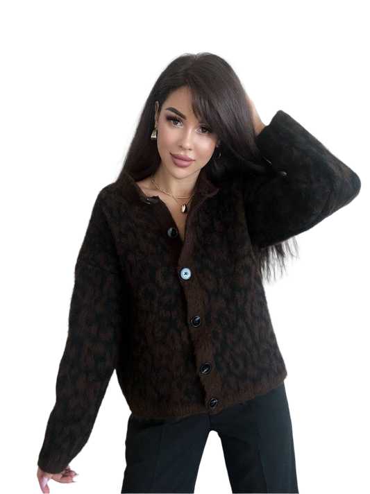 Woman wearing a brown patterned jacket on a white background