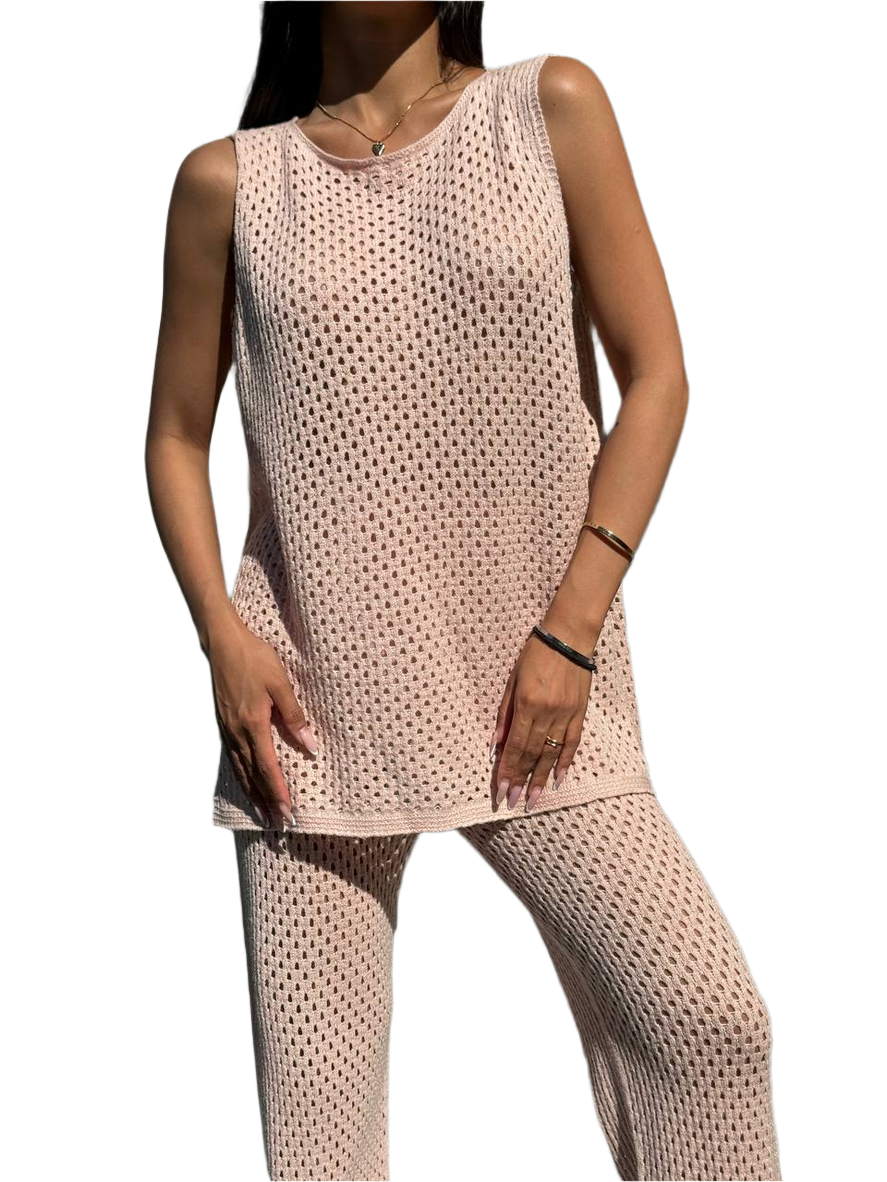 Woman wearing a beige mesh outfit on a white background