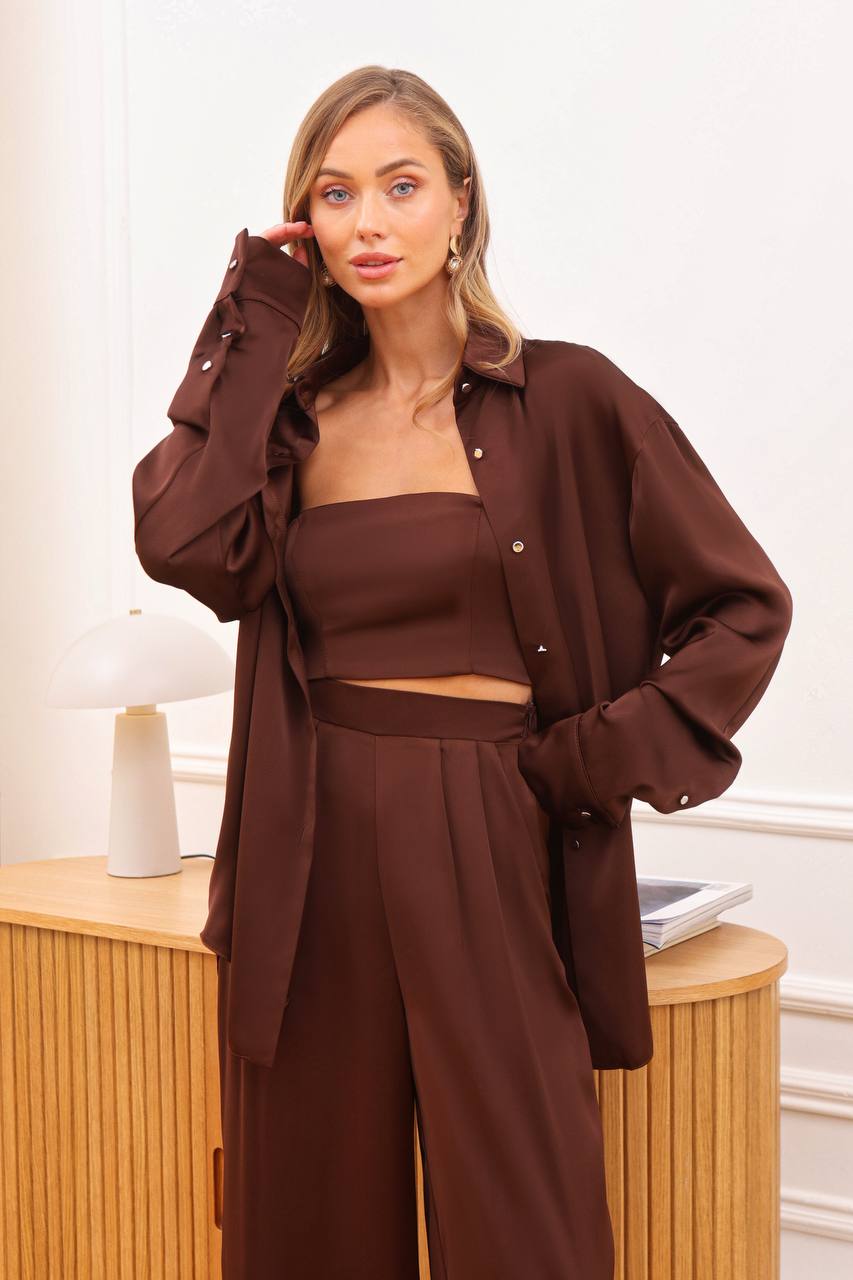 Woman wearing a brown outfit in an indoor setting