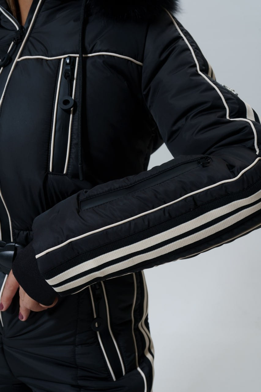 Black puffer jacket with white accents on a plain background