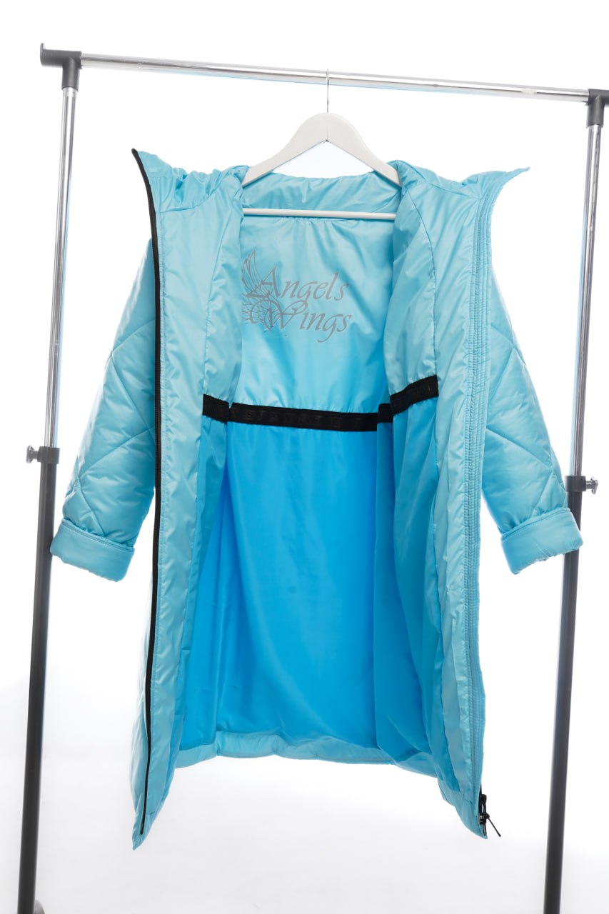 Blue raincoat with black trim on a hanger against a white background