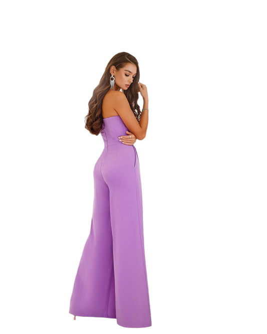 Woman wearing a purple jumpsuit on a white background