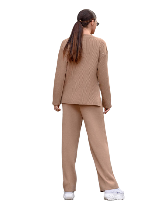 Woman wearing a beige suit on a white background