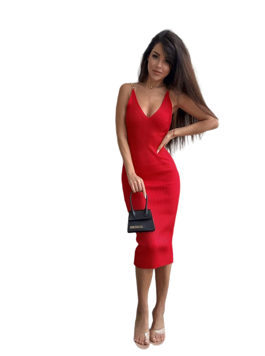 Woman wearing a red dress holding a black handbag on a white background