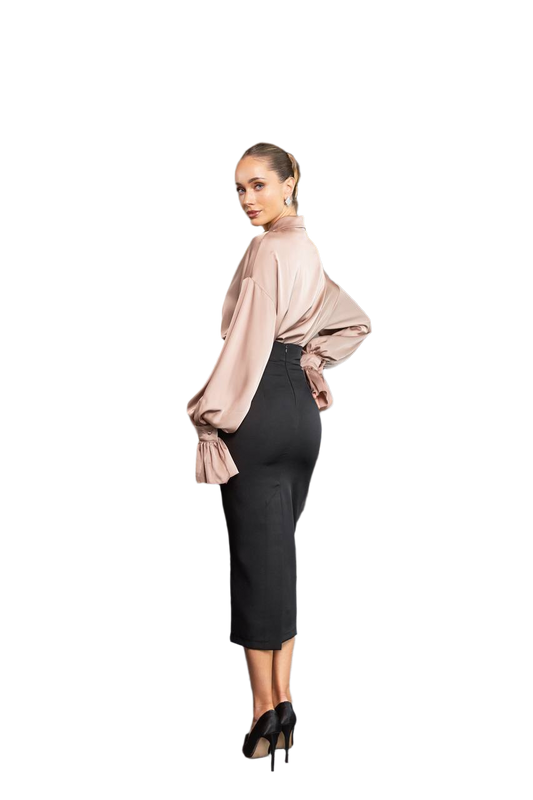 Woman wearing a beige blouse and black pencil skirt on a white background