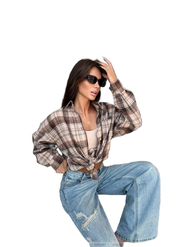 Woman wearing a plaid shirt and jeans on a white background