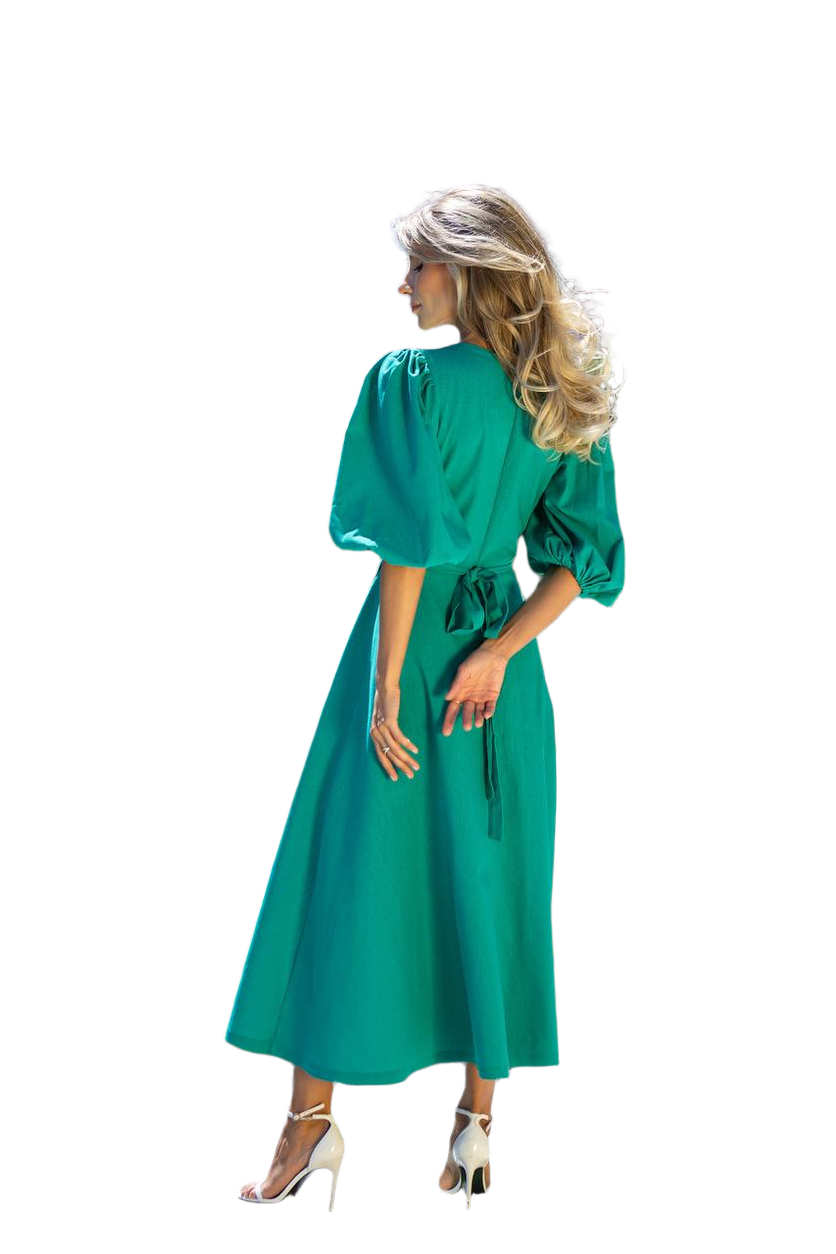Woman wearing a green dress on a white background