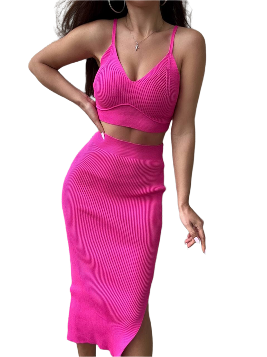 Woman wearing a bright pink two-piece outfit on a white background