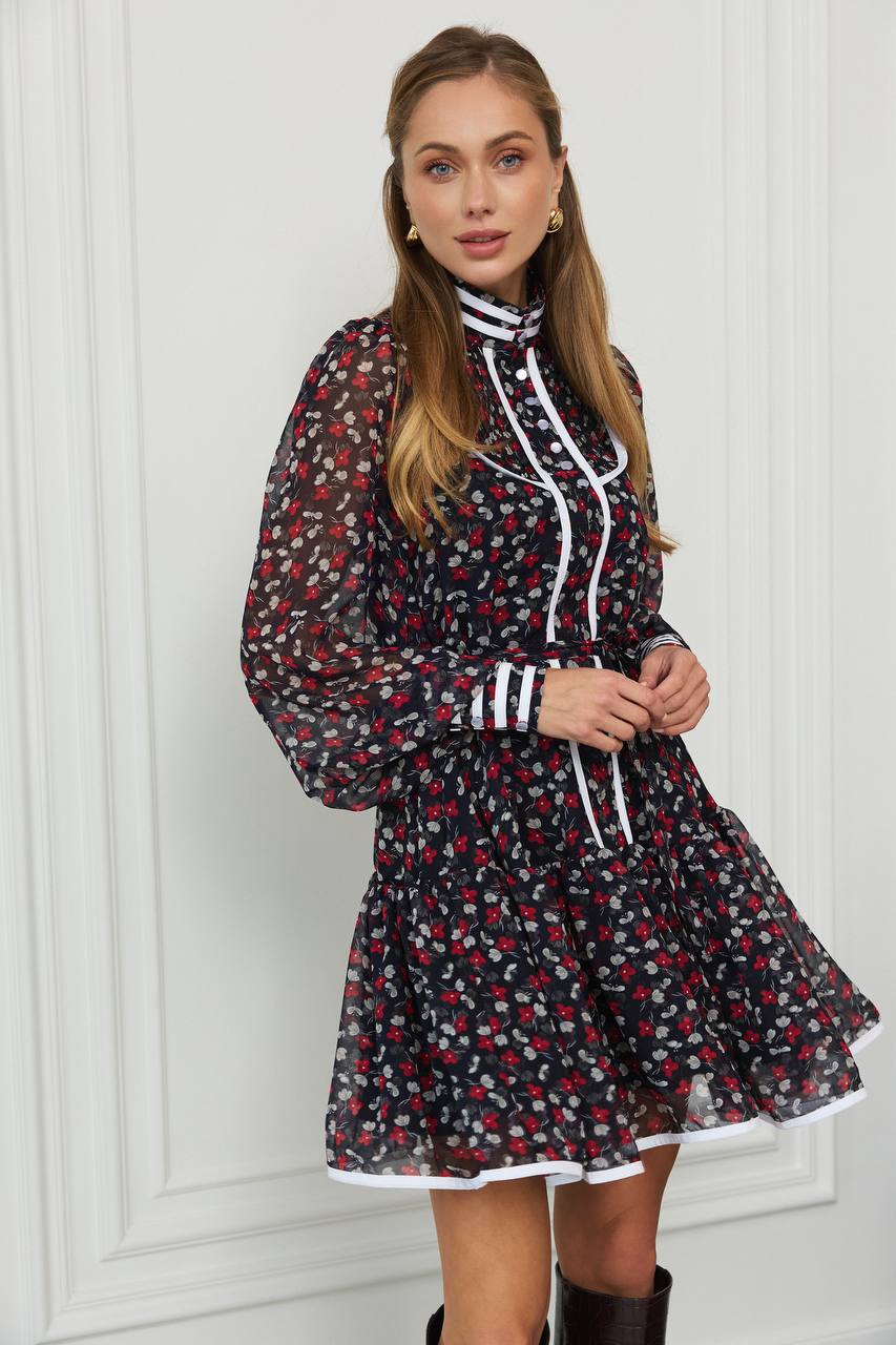 Woman wearing a floral dress with a white background