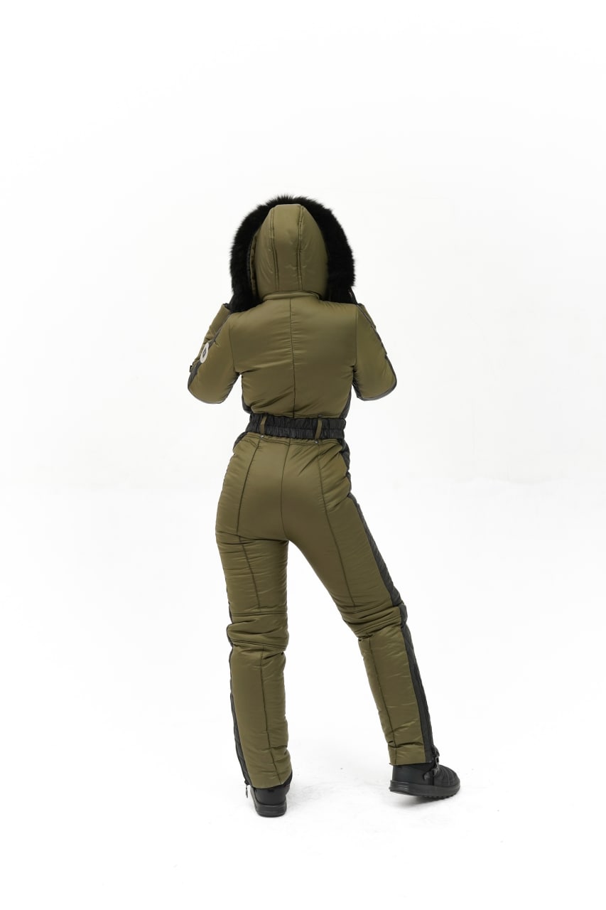 Person wearing a green jumpsuit on a white background