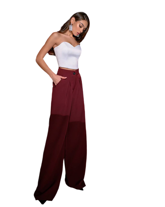 Woman wearing a white top and burgundy wide-leg pants on a white background
